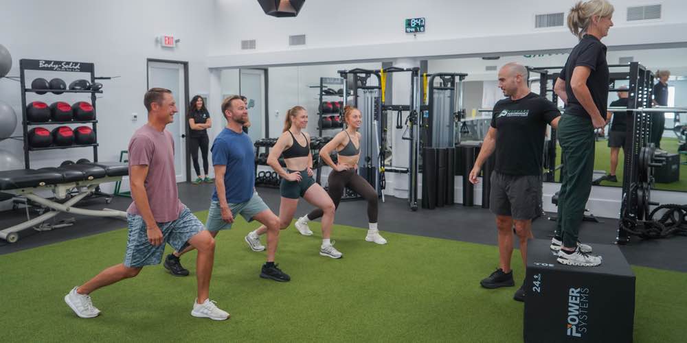 Dr. Will with Class doing a group fitness class for Thigh Blast.